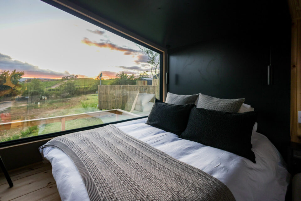 22: bed facing a wide picture window onto the valley at sunset, Old Mac Daddy, Elgin Valley