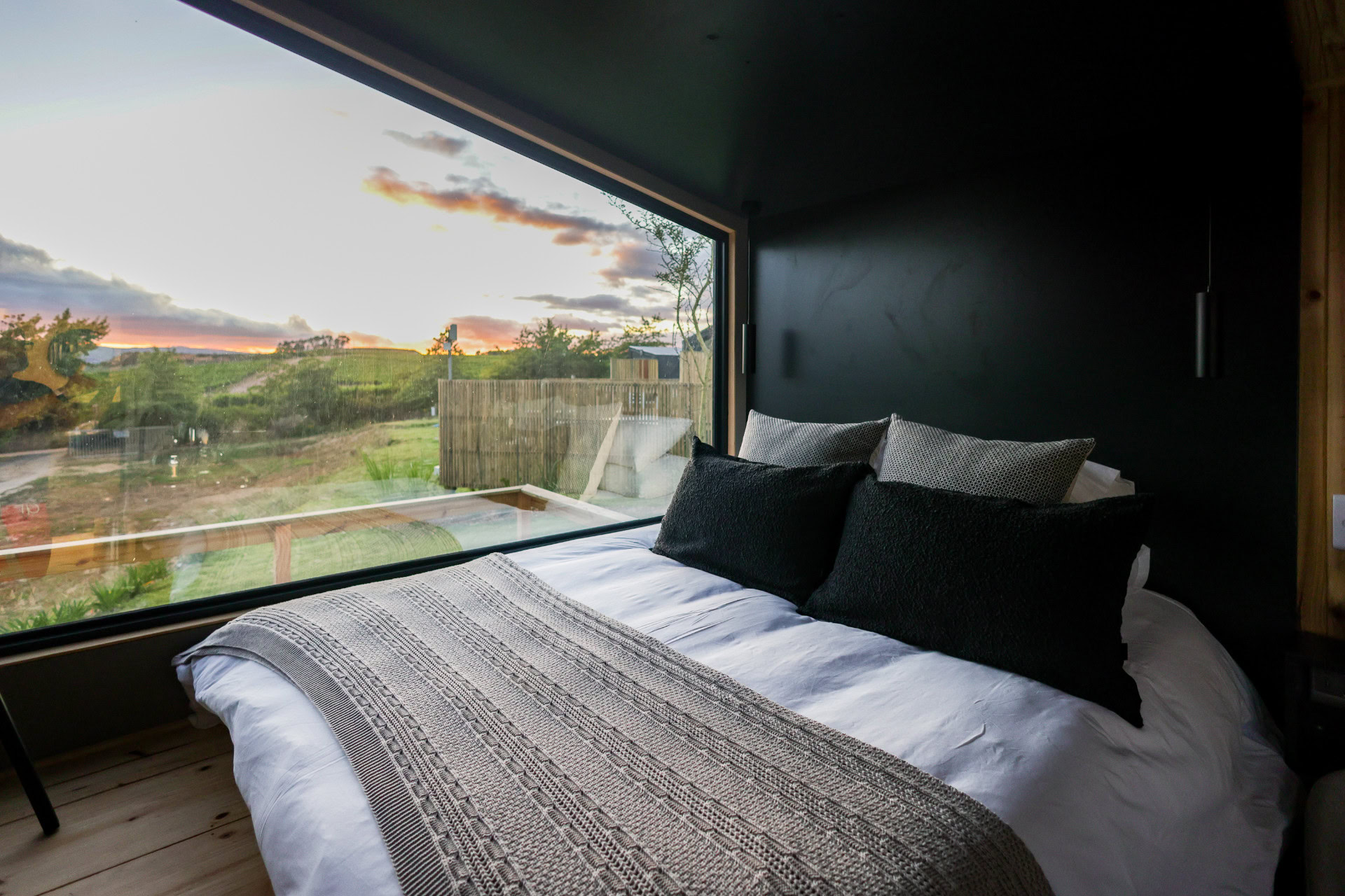 22: bed facing a wide picture window onto the valley at sunset, Old Mac Daddy, Elgin Valley