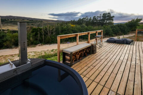 22: wood-fired hot tub on the deck, firewood bench and bar stools, Old Mac Daddy, Elgin Valley