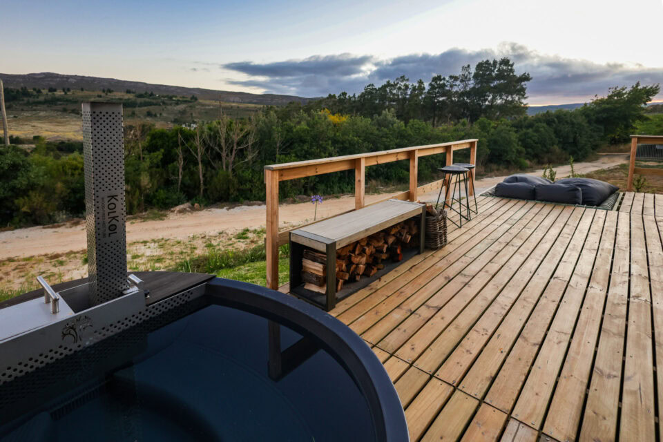 22: wood-fired hot tub on the deck, firewood bench and bar stools, Old Mac Daddy, Elgin Valley