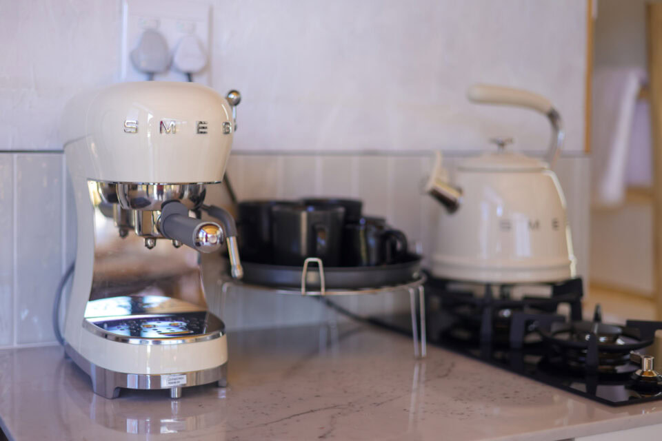 Aardvark: cream SMEG espresso machine and kettle on a marble counter, Old Mac Daddy, Elgin Valley