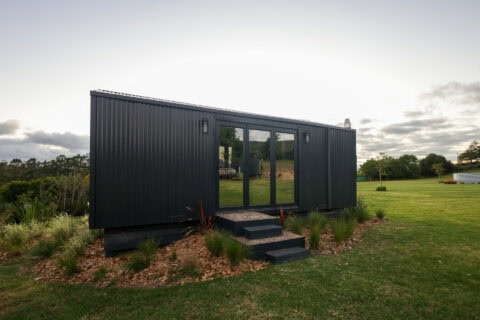 Asem: black unit on the lawn with steps up to glass doors, Old Mac Daddy, Elgin Valley