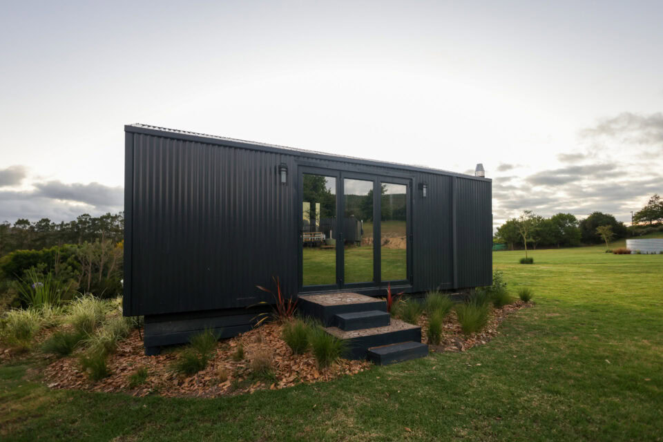 Asem: black unit on the lawn with steps up to glass doors, Old Mac Daddy, Elgin Valley