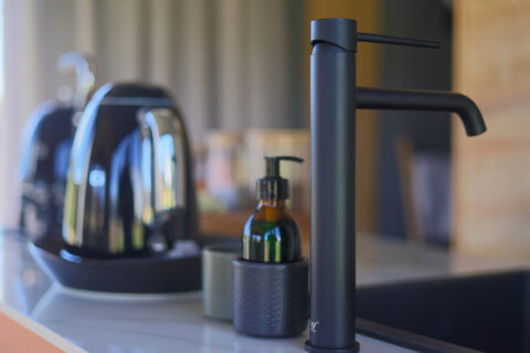 Asem: black kettle and hand soap beside a matt-black tap, Old Mac Daddy, Elgin Valley