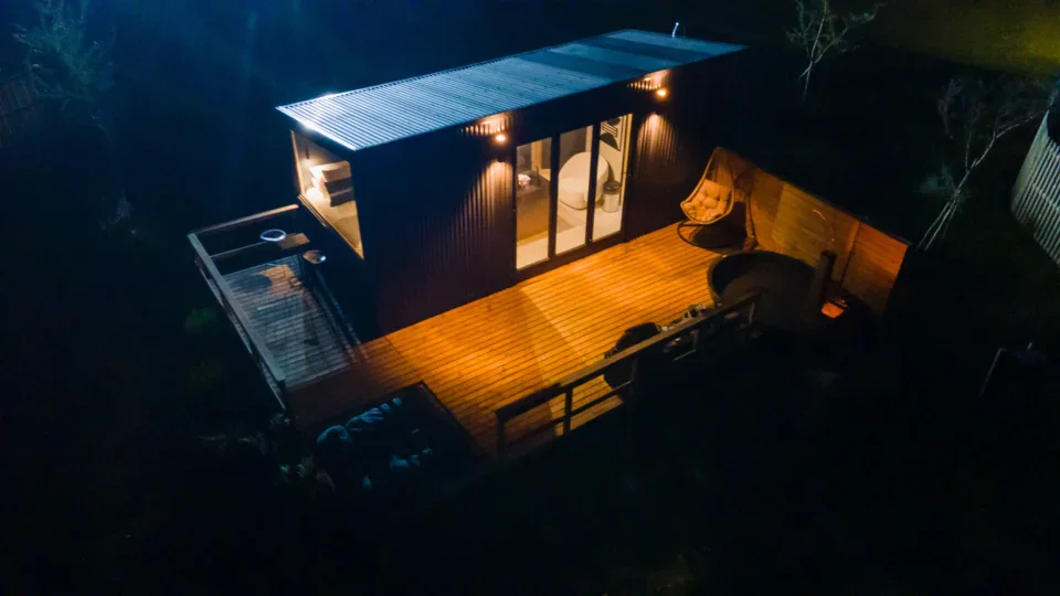 Team Building Cabins glowing at night from above, Old Mac Daddy, Elgin Valley