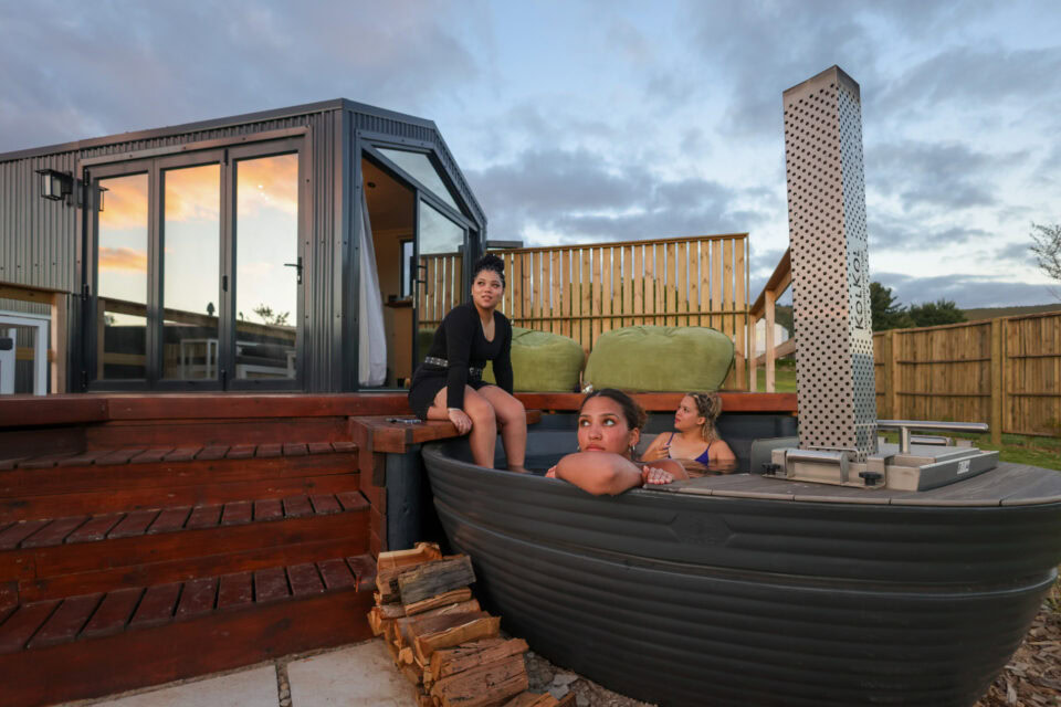 Palimpses: three guests in the wood-fired hot tub at dusk, Old Mac Daddy, Elgin Valley