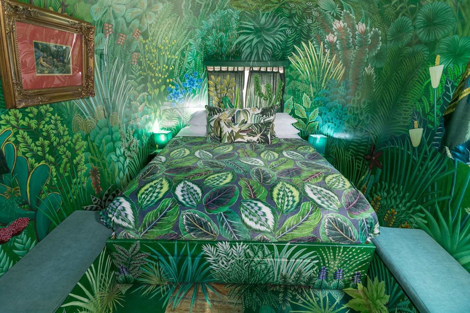 The Dream: bed with a leaf-print cover in a room painted with a jungle mural, Old Mac Daddy, Elgin Valley
