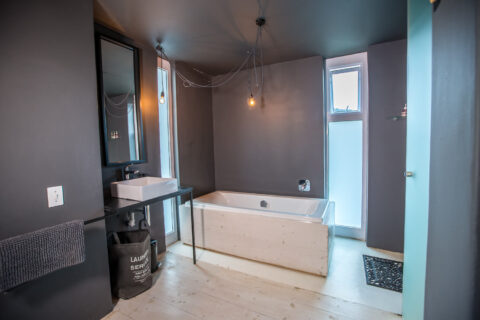 The School House: bathroom with a freestanding bath and dark walls, Old Mac Daddy, Elgin Valley