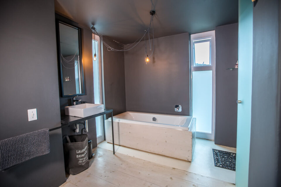 The School House: bathroom with a freestanding bath and dark walls, Old Mac Daddy, Elgin Valley