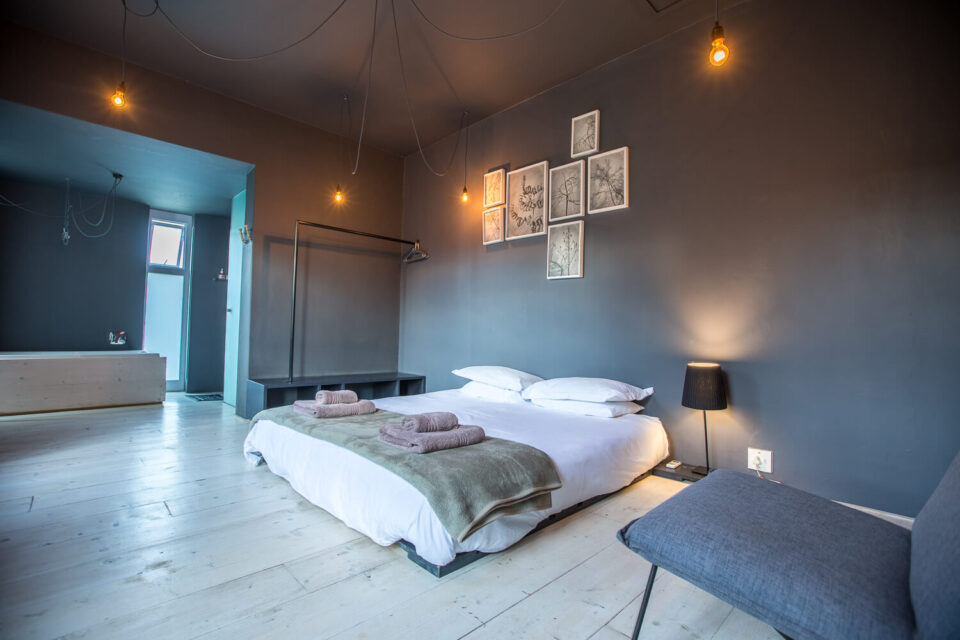 The School House: grey bedroom with a double bed and framed prints, Old Mac Daddy, Elgin Valley