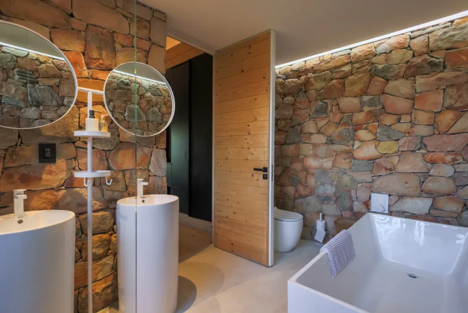 Apple Grove: bathroom with stone walls, a freestanding bath and twin pedestal basins, Old Mac Daddy, Elgin Valley