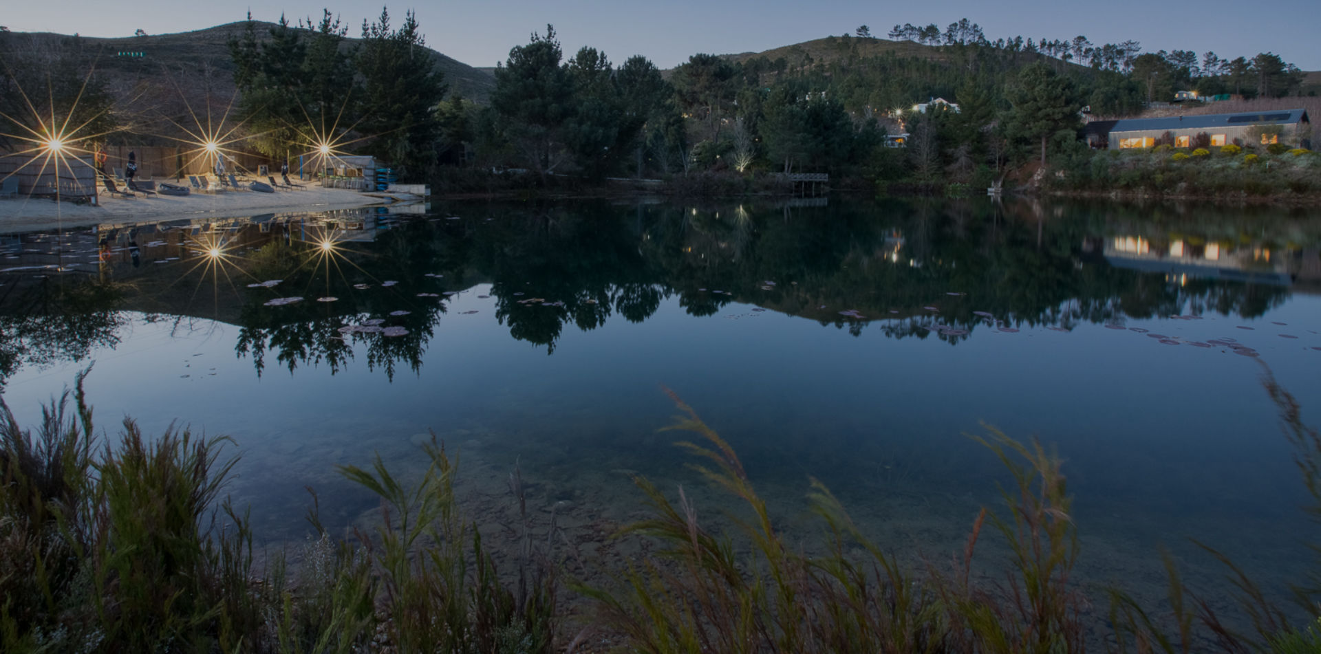 The lake at dusk, lights reflected in the water, Old Mac Daddy, Elgin Valley