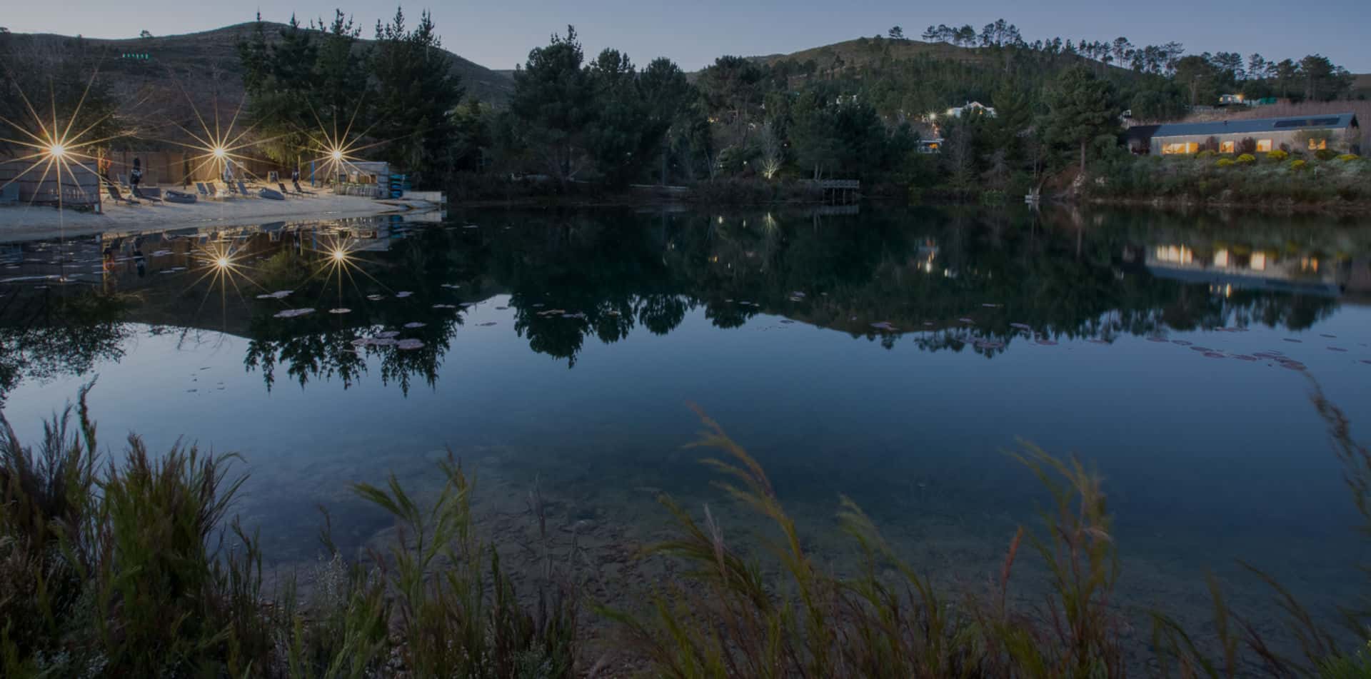 view of the lake at dusk