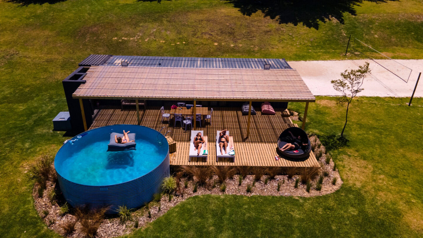 Klein Paradys: aerial view of guests sunbathing beside a round plunge pool on a covered deck, Old Mac Daddy, Elgin Valley