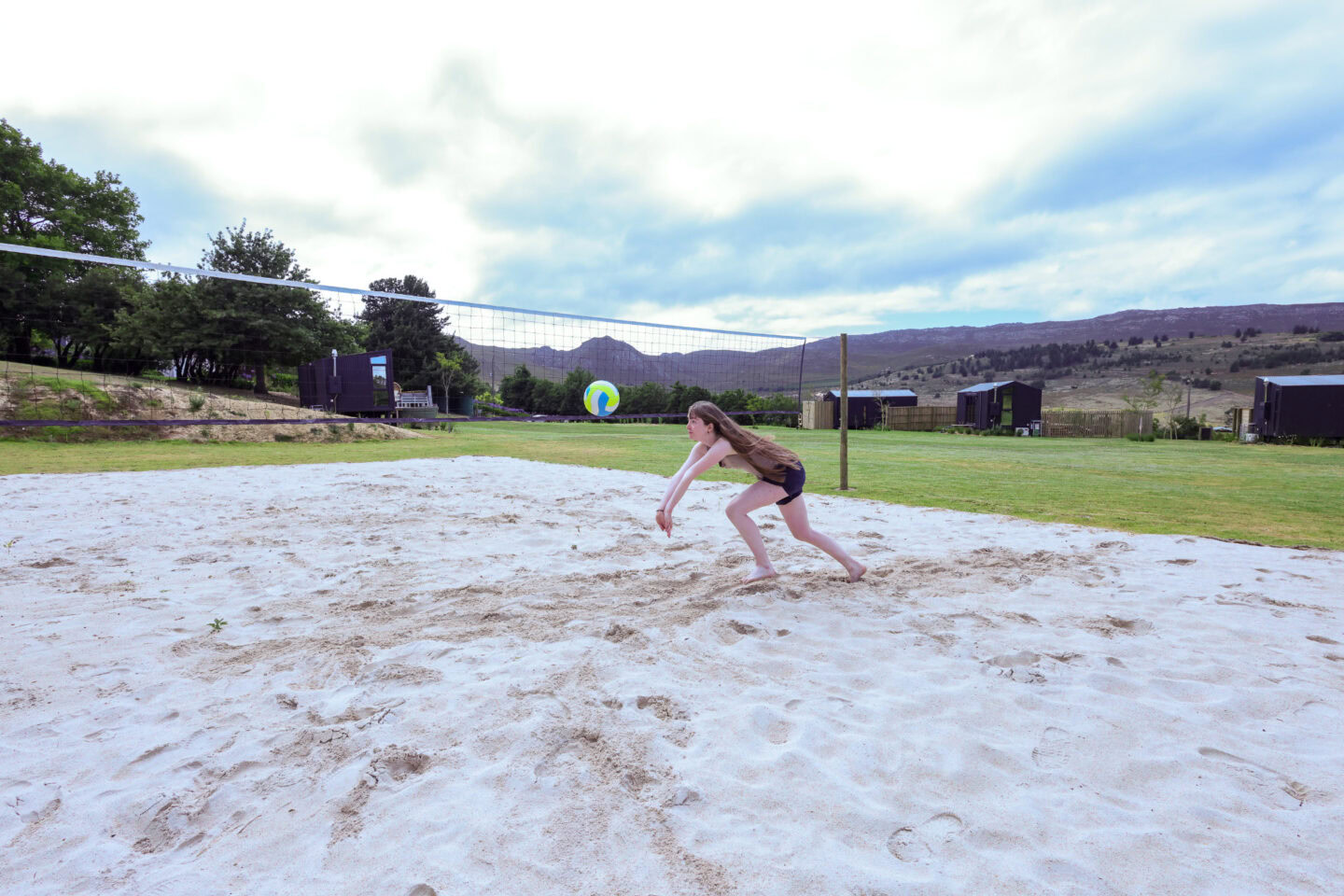 Klein Paradys: a girl diving for the ball on the sand volleyball court, Old Mac Daddy, Elgin Valley