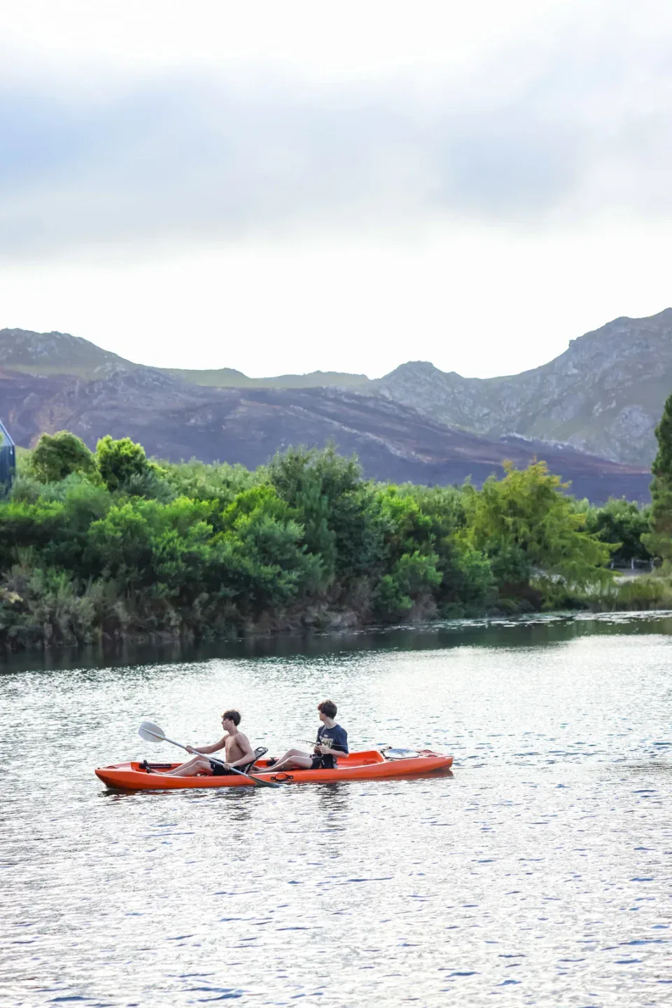 Team Building Two adults kayaking, mountains behind, Old Mac Daddy, Elgin Valley