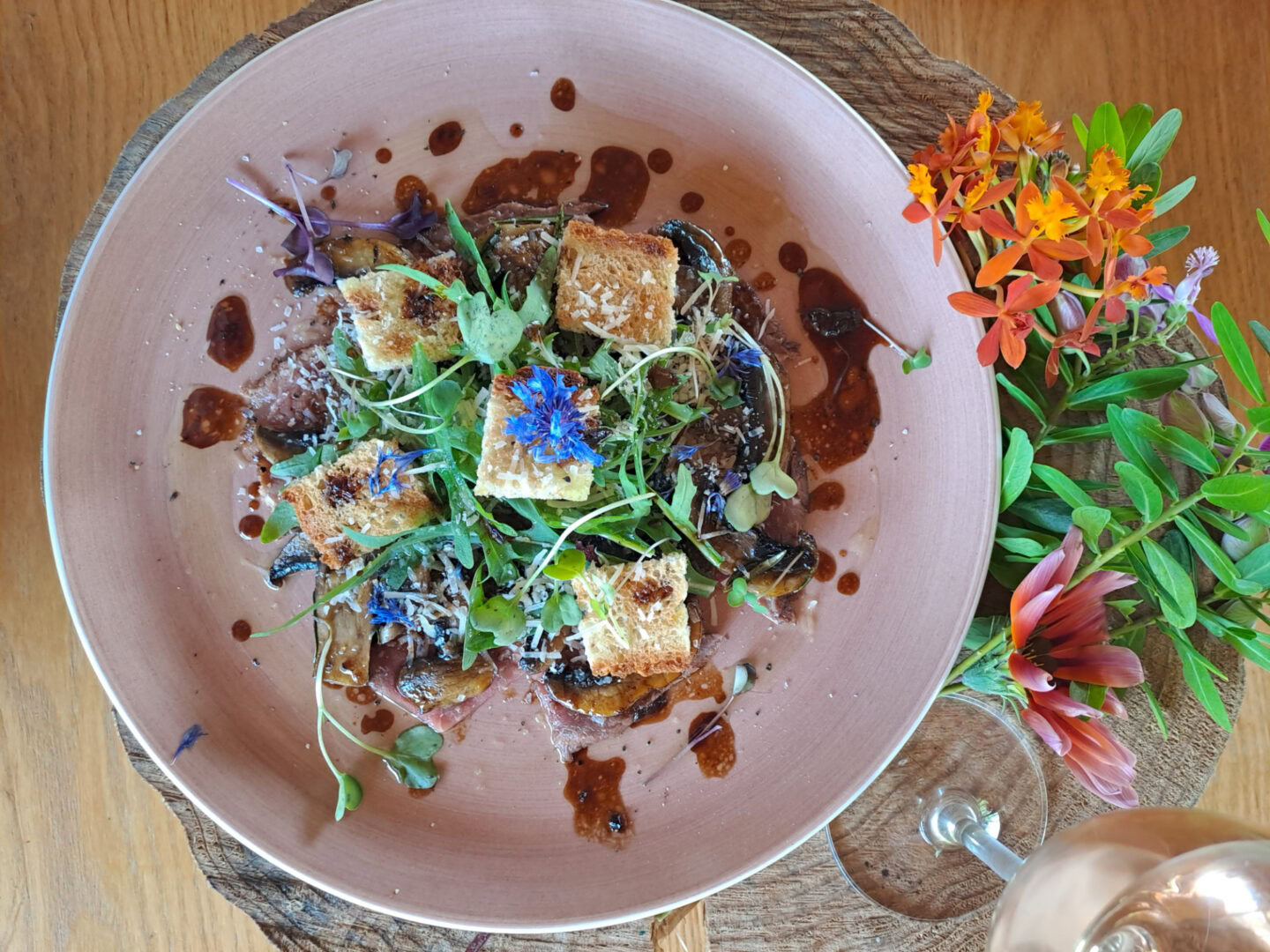 A salad with toasted cubes, microgreens and a dark sauce, Old Mac Daddy, Elgin Valley