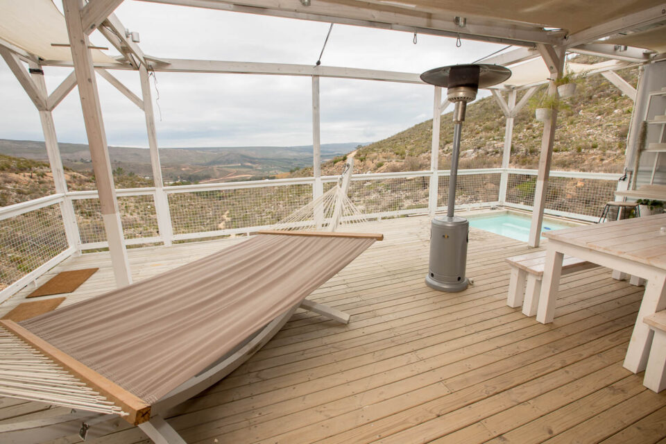 Daddy's Hideaway: deck with a hammock lounger, patio heater and plunge pool above the valley, Old Mac Daddy, Elgin Valley