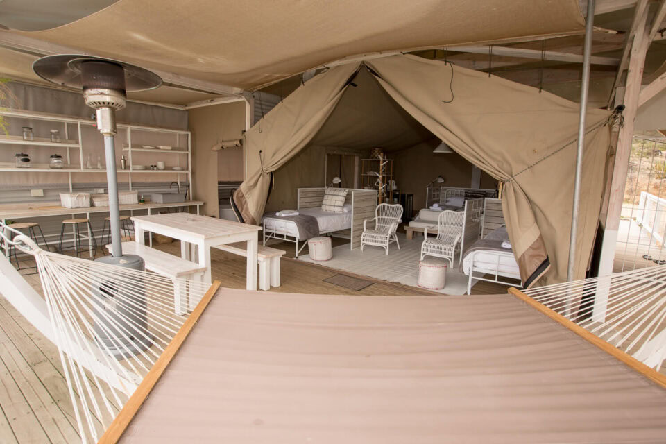 Daddy's Hideaway: deck hammock and patio heater, tented bedroom and dining area behind, Old Mac Daddy, Elgin Valley