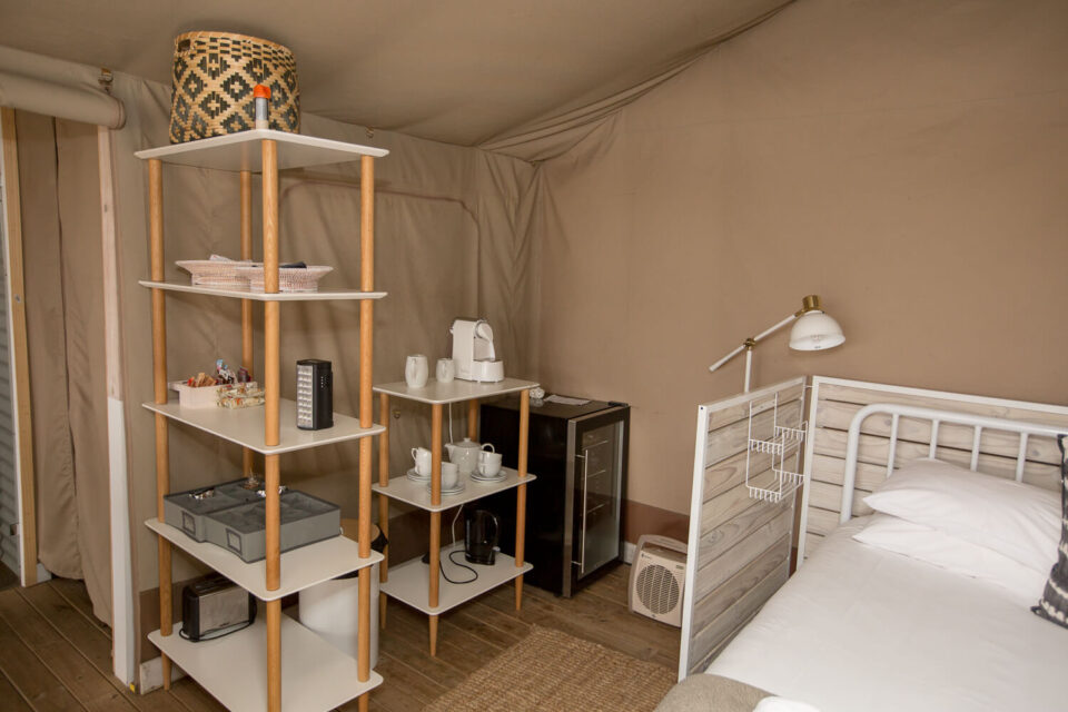 Daddy's Hideaway: tented bedroom with open shelving, a bar fridge and a single bed, Old Mac Daddy, Elgin Valley