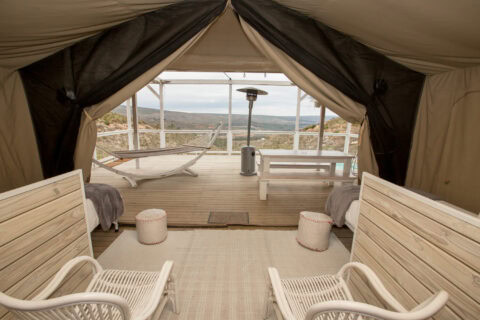 Daddy's Hideaway: view from the tent onto the deck, hammock loungers and the valley, Old Mac Daddy, Elgin Valley