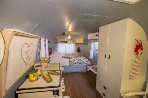 For Better or Boerewors: Airstream with a vintage stove, a heart painted panel and a bed at the far end, Old Mac Daddy, Elgin Valley
