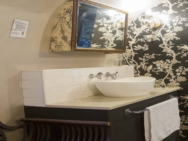 Life Before Colour: vessel basin and gilt mirror against black and cream toile wallpaper, Old Mac Daddy, Elgin Valley