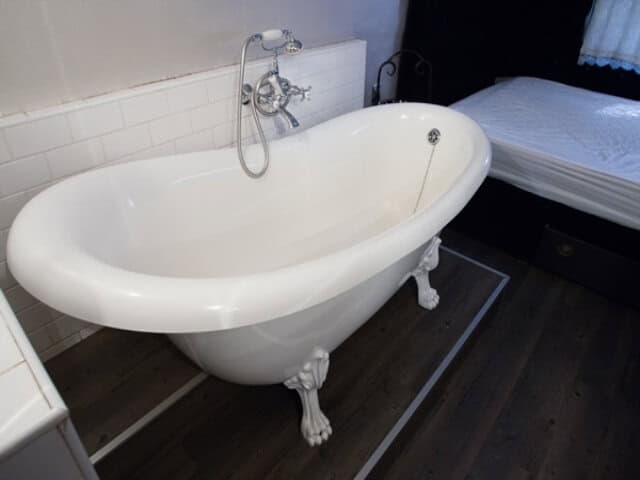 Life Before Colour: clawfoot bath beside the bed, Old Mac Daddy, Elgin Valley