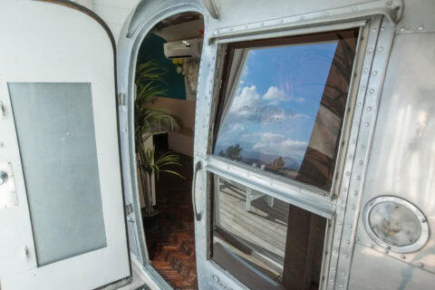 Private Life of Plants: the open Airstream door with a view through its window, Old Mac Daddy, Elgin Valley