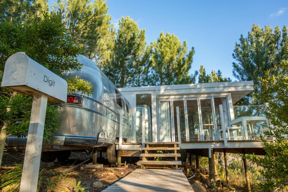 Dig'It: the Airstream and its glass-walled deck, with a name mailbox, Old Mac Daddy, Elgin Valley