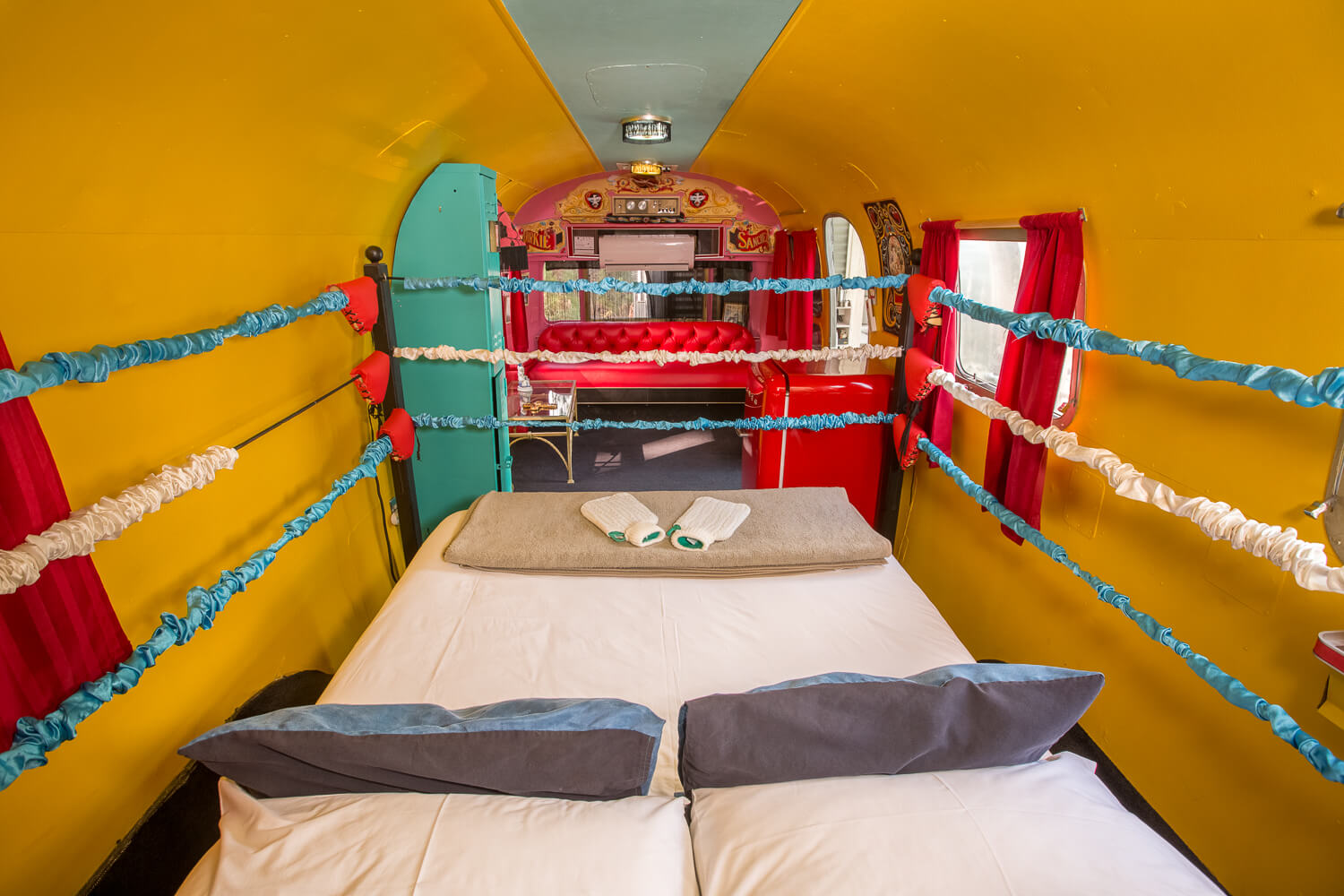 Dirkie Sanchez: bed framed by boxing-ring ropes, yellow walls, Old Mac Daddy, Elgin Valley