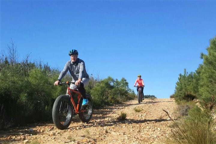 Two cyclists riding fat-tyre bikes along a gravel trail, Old Mac Daddy, Elgin Valley