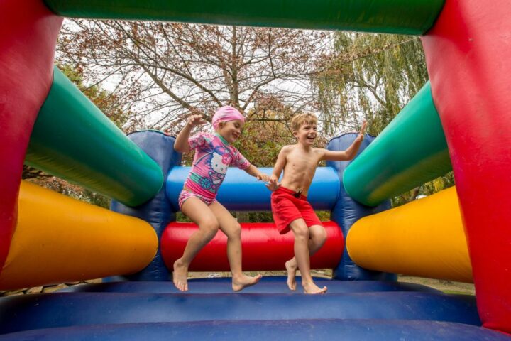 Two children jumping on a jumping castle, Old Mac Daddy, Elgin Valley