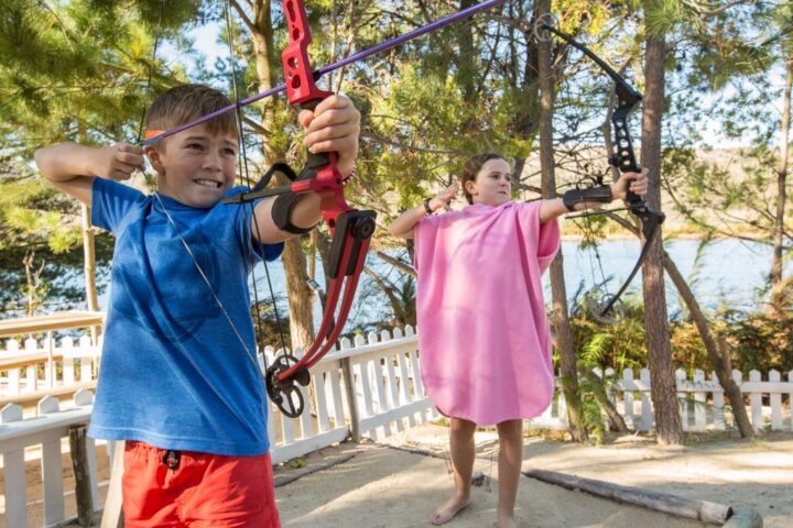 Two children practising archery by the lake, Old Mac Daddy, Elgin Valley