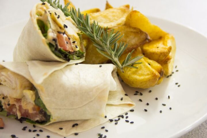 A wrap cut in half with potato wedges and rosemary, Old Mac Daddy, Elgin Valley