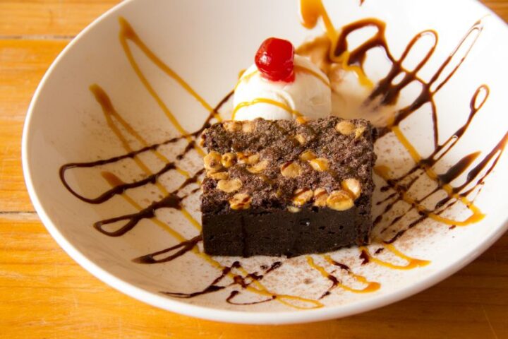 A brownie with ice cream, a cherry and chocolate and caramel sauce, Old Mac Daddy, Elgin Valley