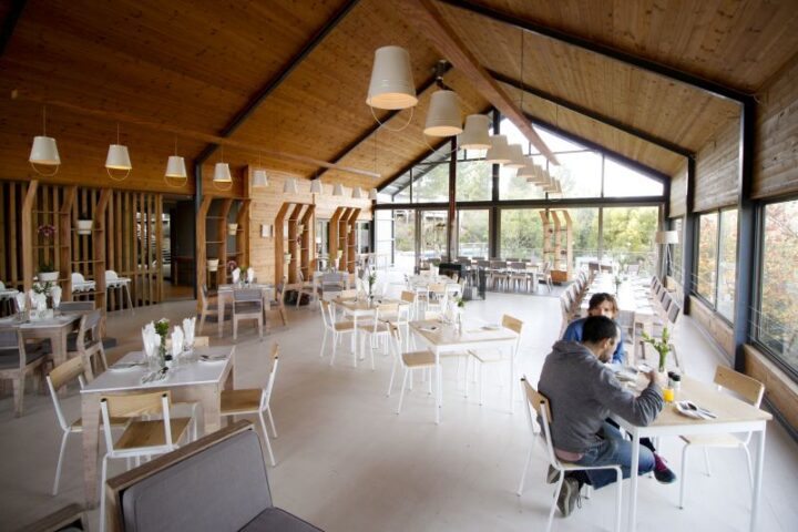 Guests eating at tables in the Barn restaurant, Old Mac Daddy, Elgin Valley