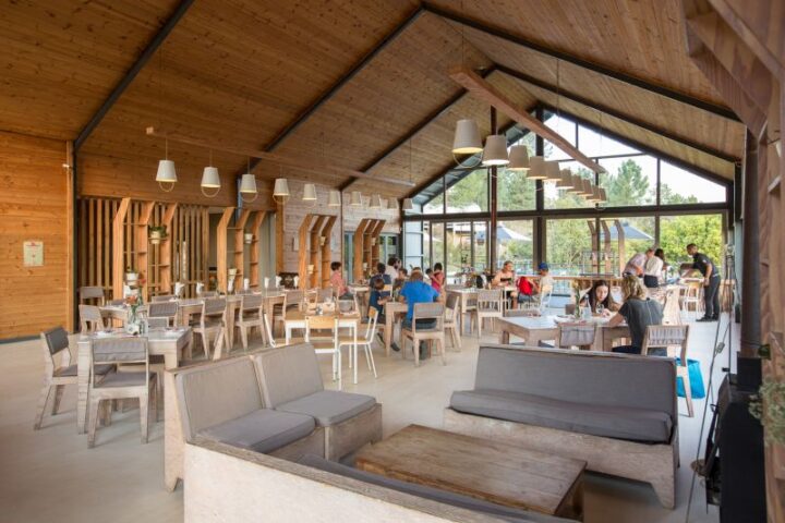 The Barn restaurant with a high timber roof and diners at tables, Old Mac Daddy, Elgin Valley