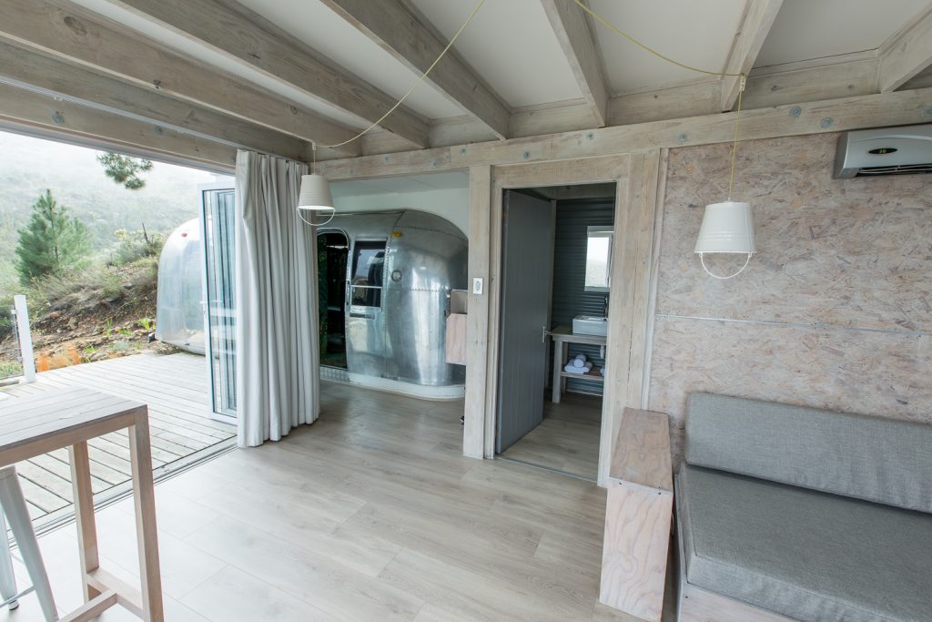 Open-plan deck room with sheer curtains, leading through to the Airstream, Old Mac Daddy, Elgin Valley
