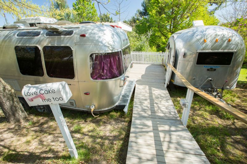 Two Airstreams either side of a boardwalk, with a Love Cake sign, Old Mac Daddy, Elgin Valley