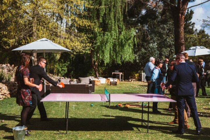 Wedding guests playing table tennis on the lawn under the trees, Old Mac Daddy, Elgin Valley