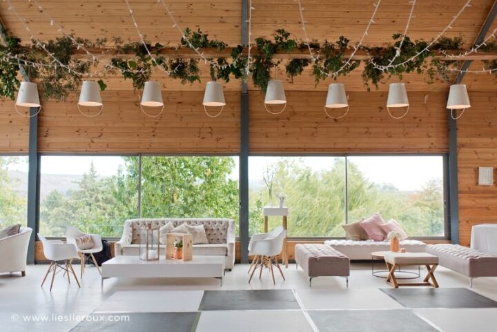 The Barn set up as a lounge with white sofas and greenery hung from the beams, Old Mac Daddy, Elgin Valley
