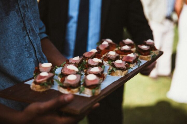A waiter holding a tray of canapés, Old Mac Daddy, Elgin Valley