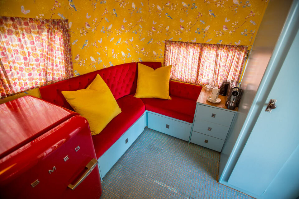 Birdy: red banquette seating with yellow cushions and a red SMEG fridge, Old Mac Daddy, Elgin Valley